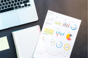 a laptop and charts